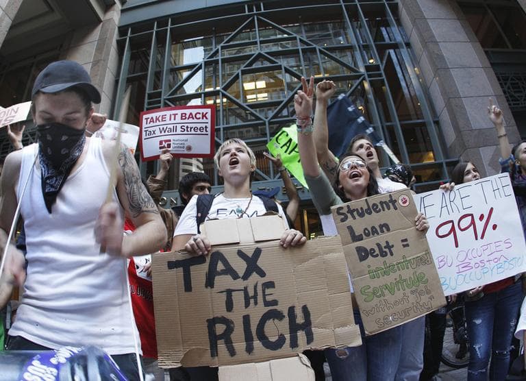 Occupy Boston protesters rally in front of a building in Boston&#039;s financial district Wednesday. (AP)