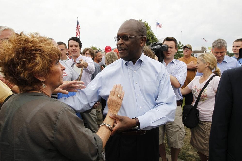 Businessman Herman Cain, campaigning at the Iowa State Fair in Des Moines, Iowa in August, is one of several candidates proposing to reform the tax code. (AP)