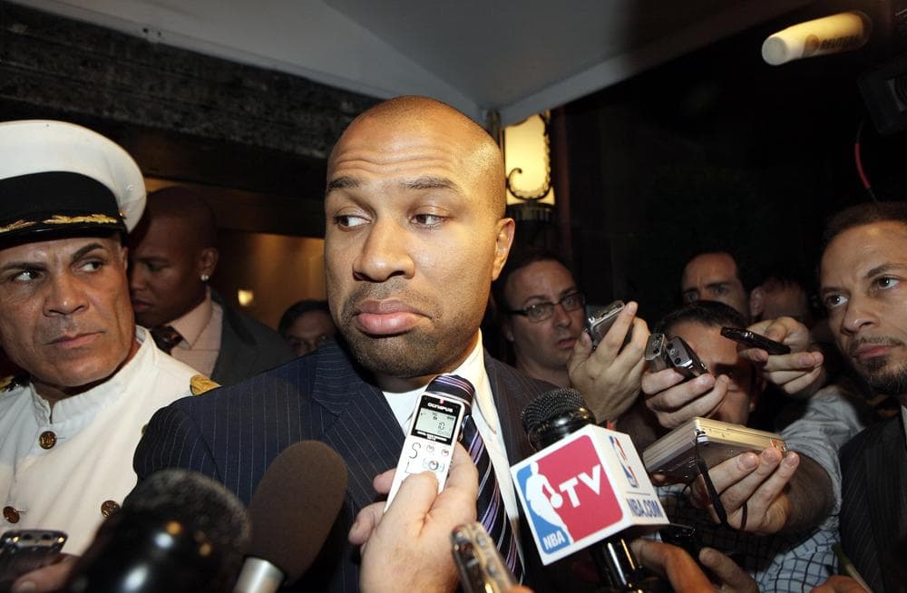 President of the Players Union Derek Fisher, center, talks with reporters after leaving stalled NBA labor talk meeting yesterday. (AP)