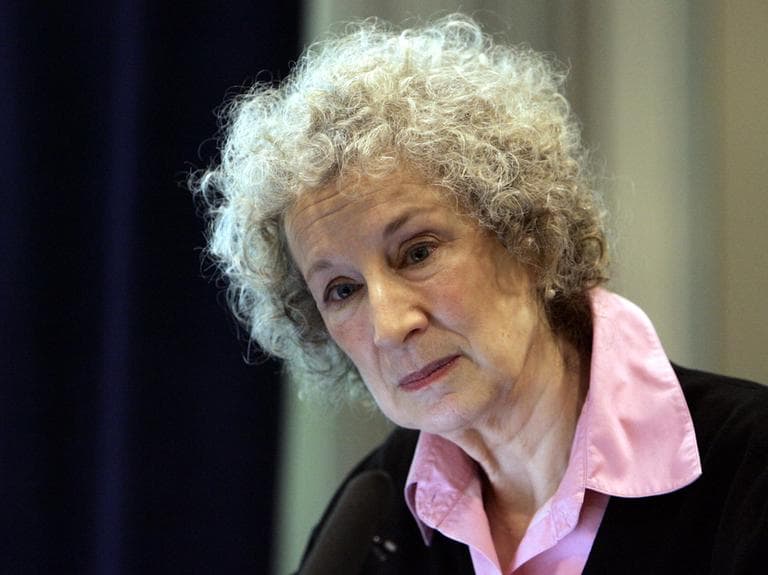 Canadian writer Margaret Atwood listens to questions during a presentation at the London's annual Book Fair, Sunday March 5, 2006. The Booker Prize-winning author on Sunday unveiled her new invention: a remote-controlled pen that allows writers to sign books for fans from thousands of miles away. (AP)