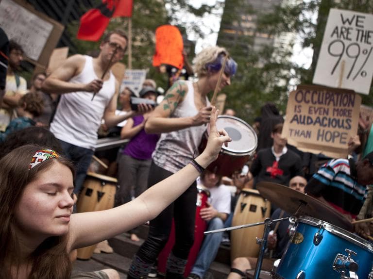 A protester affiliated with the &quot;Occupy Wall Street&quot; demonstration listens to a drum circle  in Zuccotti Park in New York, on Monday, Oct. 10, 2011. (AP)