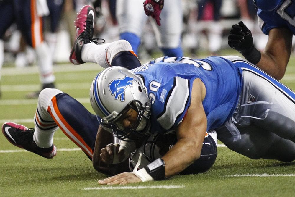 Detroit Lions defensive tackle Ndamukong Suh brings down Sam Hurd of the Chicago Bears on the last play of Monday nights game. Detroit came out on top with the final score 24-13. (AP)