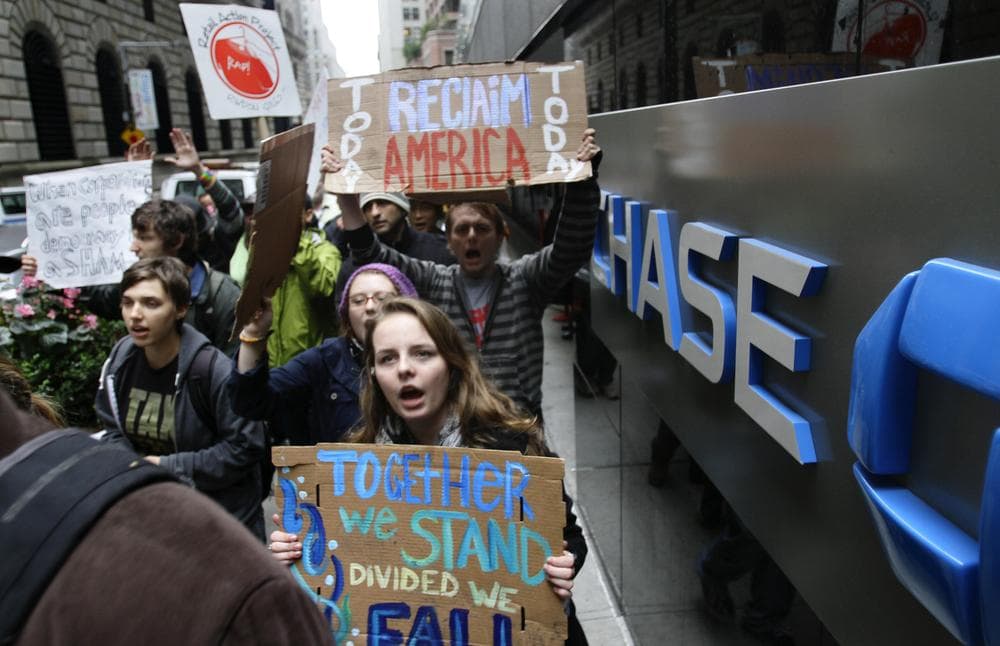 Occupy Wall Street protesters march around One Chase Manhattan Plaza on Wednesday. (AP)