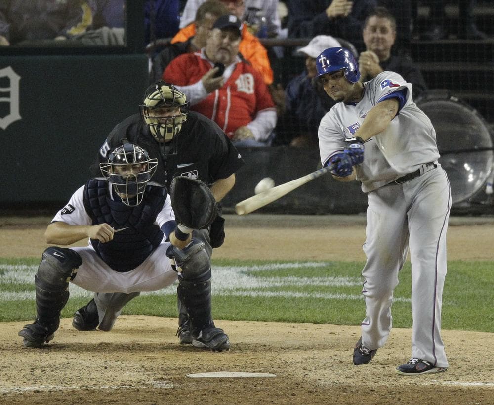 Nelson Cruz hits a two-run home run in the eighth inning during Game 5 of the ALCS on Thursday. The Tigers won 7-5 but Texas still leads the series 3-2. (AP)