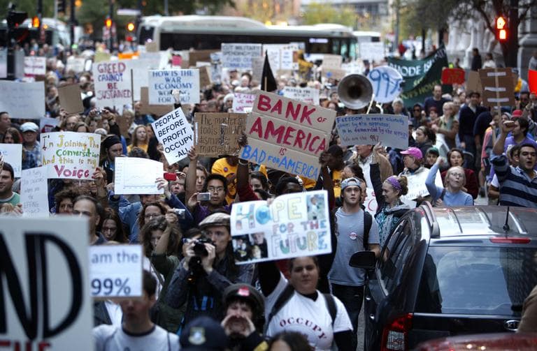 Occupy Providence protesters march through the streets in downtown Providence, R.I., Saturday, Oct. 15, 2011. (AP)