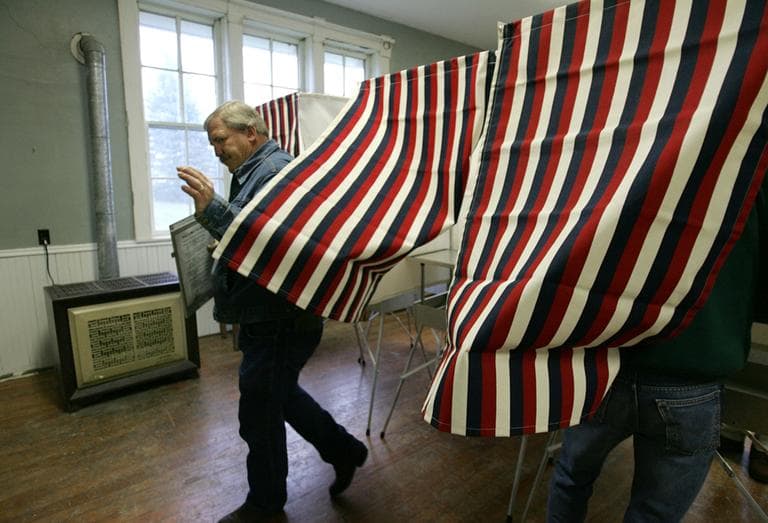 Don Huntrods, of Van Meter, Iowa, emerges from a voting booth after casting his ballot, in Lee Township, Iowa, Tuesday, Nov. 2, 2004. (AP)