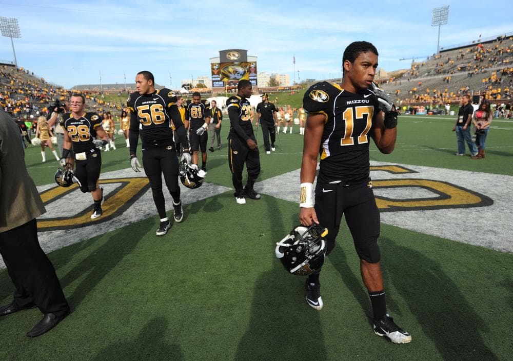 Members of the Missouri Tigers football team walk off the field after a game against Oklahoma State on October 22. The Tigers are rumored to be leaving the Pac 12 conference for the SEC. (AP)