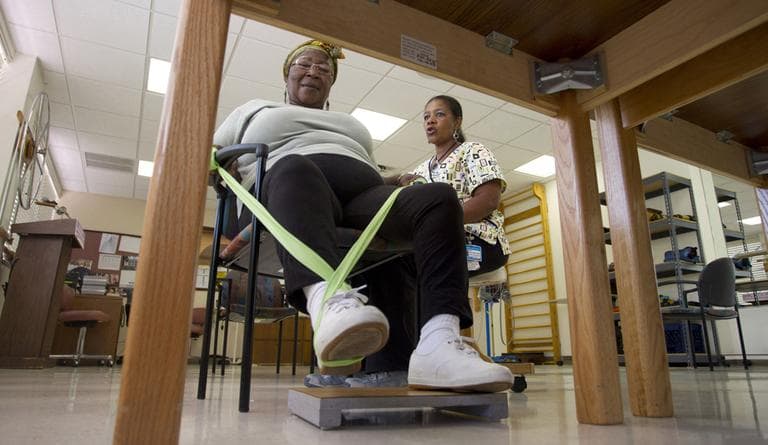 Elmaze Joseph, left, works with therapist Jocelyne Denis doing foot exercises at the Miami Jewish Home and Hospital in Miami. Across the U.S., facilities are widely expanding in-home care and assisted living, and looking to new ways to generate income beyond their traditional role of housing the elderly during the last years of their lives. (AP)