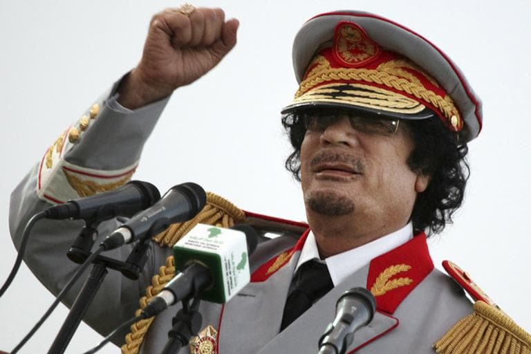 Libyan leader Moammar Gadhafi talks during a ceremony to mark the 40th anniversary of the evacuation of the American military bases in the country, in Tripoli, Libya (AP)