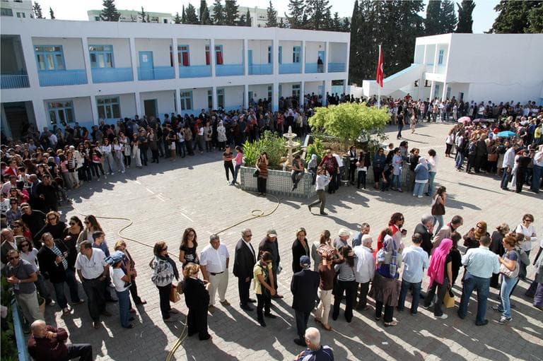 Tunisians voters queue at a polling station in Menzeh, near Tunis, Sunday, Oct. 23. (AP)