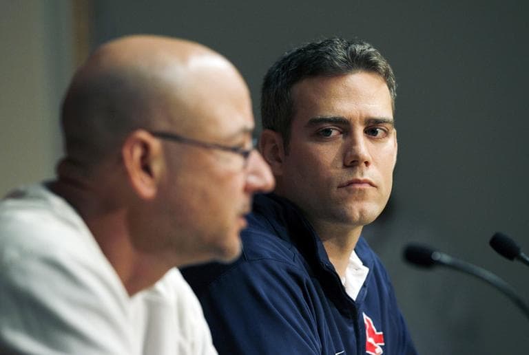 Theo Epstein, left, watches as Terry Francona speaks at a press conference (AP)
