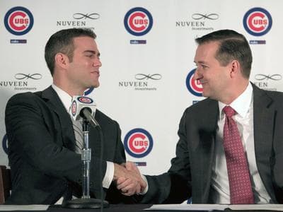 Former Boston Red Sox general manager Theo Epstein, left, shakes hands with Chicago Cub's owner Tom Ricketts, Tuesday. (AP)