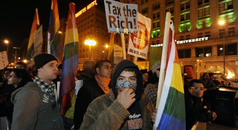 Protesters during an Occupy Chicago march and protest at Grant Park in Chicago, early Sunday, Oct. 23, 2011. (AP)