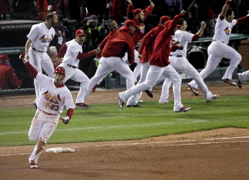 David Freese reacts after hitting a solo home run off a pitch by Texas Rangers' Mark Lowe in the 11th inning of Game 6 of the World Series on Thursday. The Cardinals won 10-9. (AP)