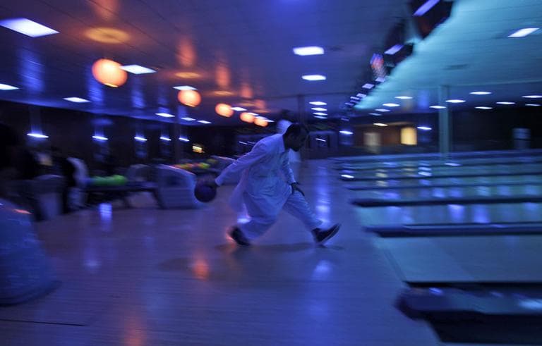 An Afghan man  plays at the Strikers, the country&#039;s first bowling center, in Kabul, Afghanistan, Friday, Oct. 28. (AP)
