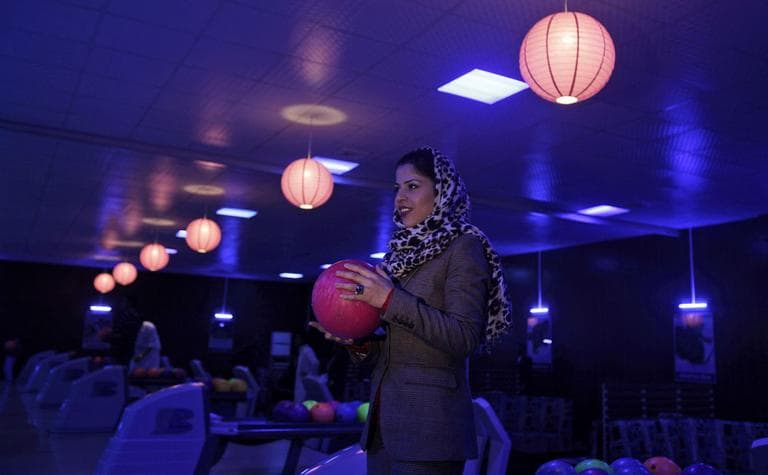 Meena Rahmani, 26, owner of The Strikers, the country&#039;s first bowling center, holds a bowling ball in Kabul, Afghanistan on Friday, Oct. 28. (AP)