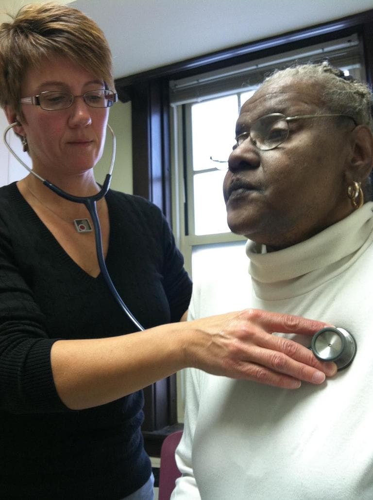Nurse Practitioner Joyce Landers sees Diana Burns at a pilot clinic inside a community mental health center in Worcester. (Martha Bebinger/WBUR)