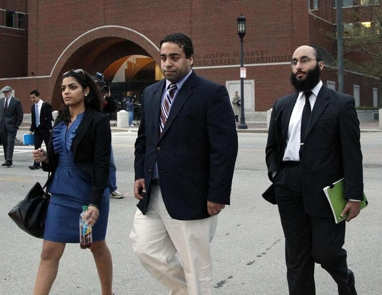 Tamer Mehanna, center, walks with two unidentified supporters from U.S. District Court in Boston, Oct. 24, after a day of jury selection in the trial of his brother, Tarek Mehanna. (AP)