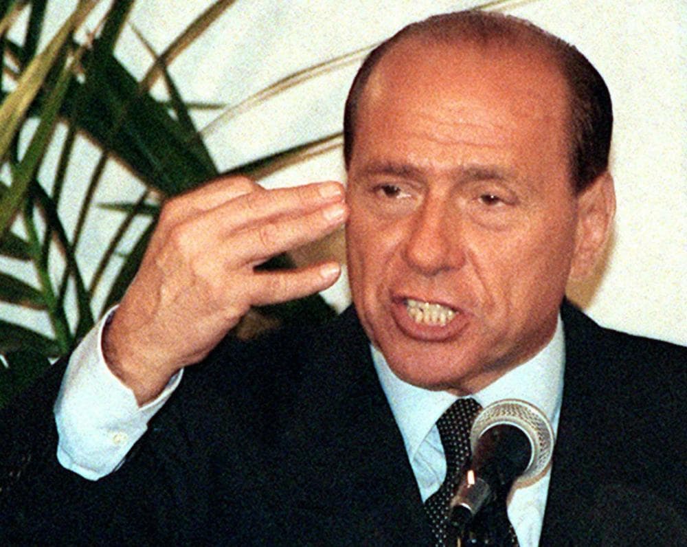 Italian Prime Minister Silvio Berlusconi, speaking at a party rally, is facing increasing pressure to step down in the wake of the European financial crisis.  (AP)