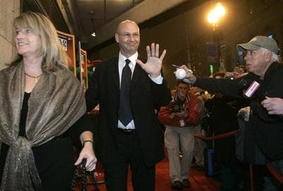In this file image, former Boston Red Sox manager Terry Francona, center, smiles and waves as he walks down the red carpet with his wife Jacque, left. (AP)