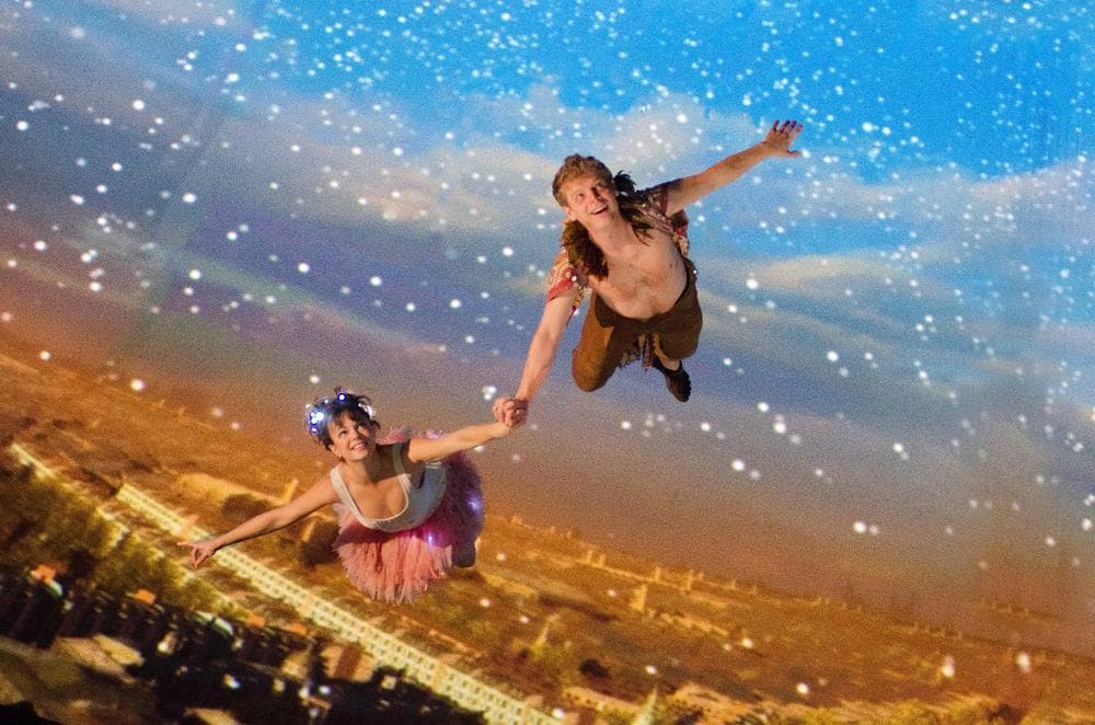 Tinker Bell (Emily Yetter) and Peter Pan (Chuck Bradley) fly to Neverland in the threesixty° stage production of &quot;Peter Pan,&quot; performed in the theater tent on Boston’s City Hall Plaza. (Andrew Brilliant/Brilliant Pictures Inc.)