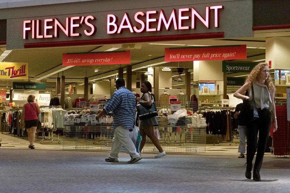 Passersby come and go from a Filene's Basement discount clothing store in a mall in Watertown, Mass. After over a hundred years in business, Filene's has filed for bankruptcy. (AP)
