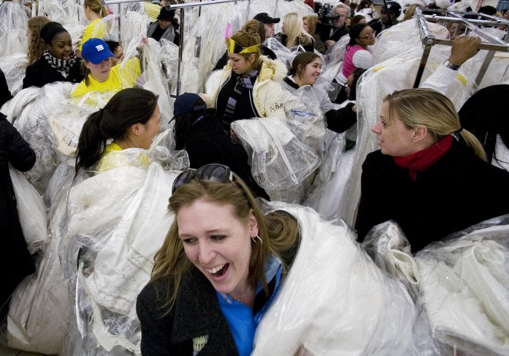 Brides-to-be and their friends join in the &quot;Running of the Brides&quot; at Filene's Basement in 2008, in New York. The department store chain held this annual Bridal Gown Event so brides-to-be can save hundreds, even thousands of dollars on designer wedding gowns. (AP)