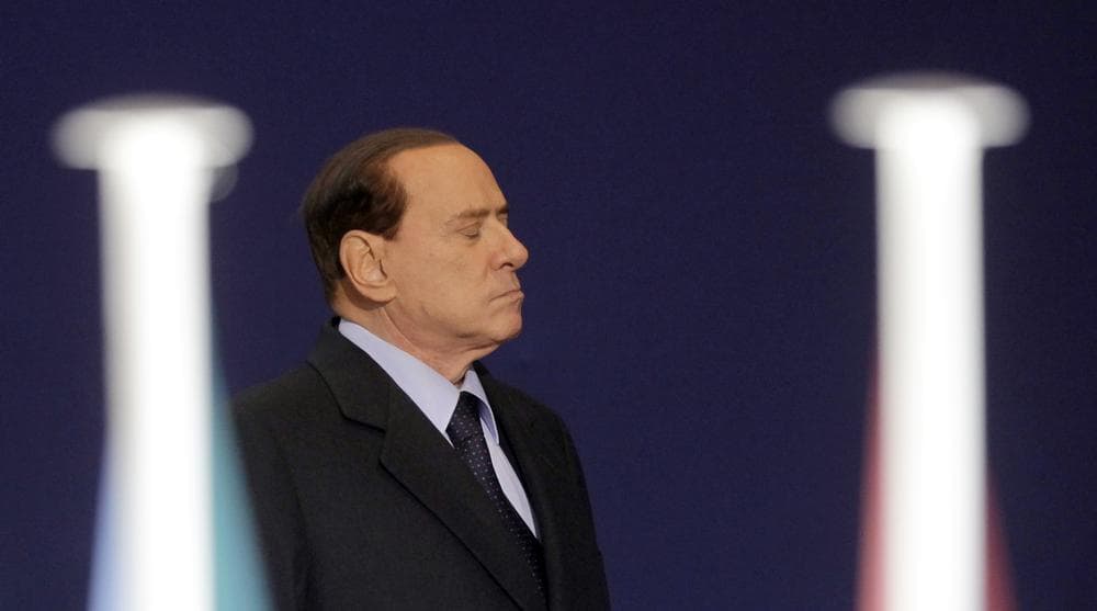 Italian Prime Minister Silvio Berlusconi leaves after a meeting at the G20 summit in Cannes, France on Thursday. (AP)
