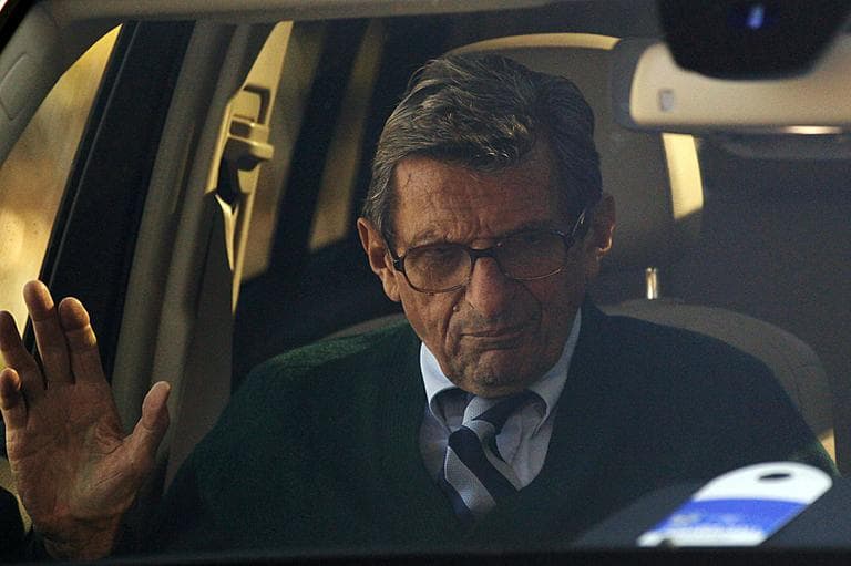 Penn State football coach Joe Paterno arrives home Wednesday, after announcing his plans to retire at the end of the college football season. (AP Photo/Matt Rourke)