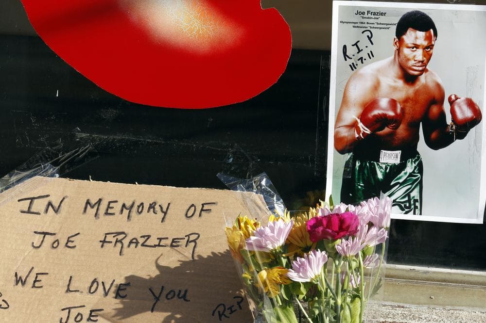 A makeshift memorial has been arranged at the former location of Joe Frazier's gym in Philadelphia. Frazier died Monday night after a brief battle with liver cancer at age 67. (AP)