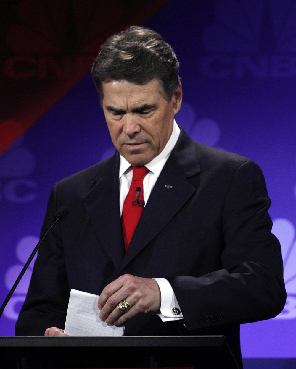 Republican presidential candidate Texas Gov. Rick Perry looks at his notes during a Republican Presidential Debate at Oakland University in Auburn Hills, Mich., Wednesday night. (AP)