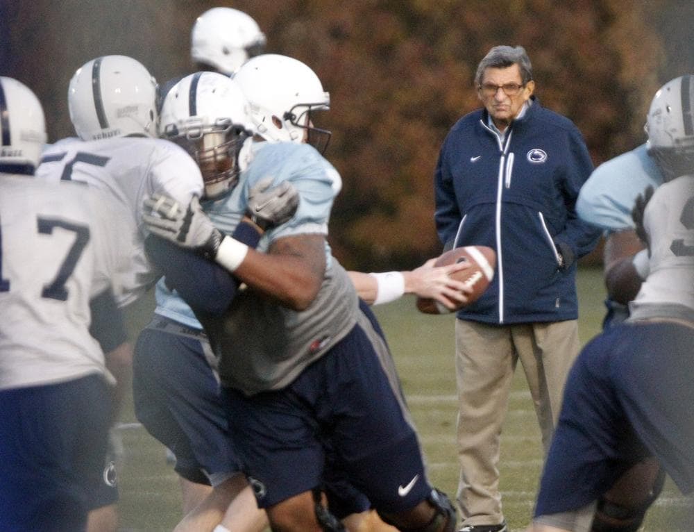 Joe Paterno watches Penn State football practice on Wednesday, his last day as head coach before he was fired by the Penn State Board of Trustees over a child sex abuse scandal. (AP)