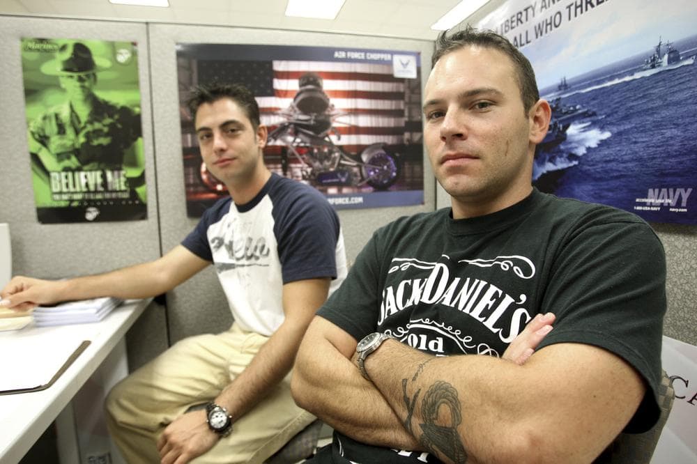 Derek Hollcraft, left, and Brandon Thomas, veterans of the current wars, discuss problems they and other veterans have encountered as they reenter civilian life at the office for student veterans at Broward Community College in Coconut Creek, Fla. (AP)