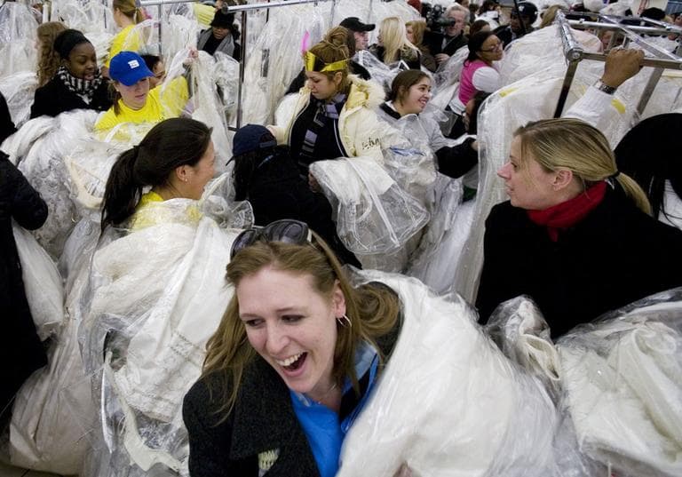 Women grab dresses in a 2008 &quot;Running of the Brides&quot; sale at Filene's Basement. (AP)