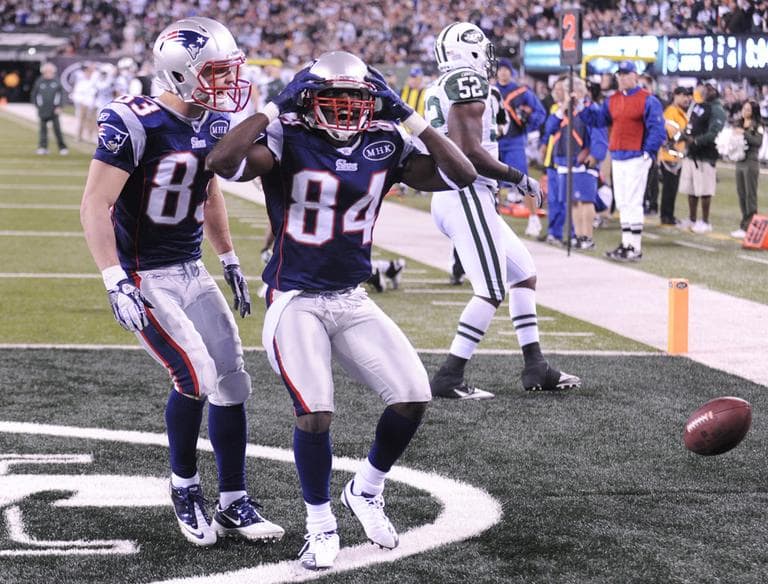 New England Patriots&#039; Deion Branch celebrates his touchdown with Wes Welker during the fourth quarter of the game against the New York Jets on Sunday. (AP) 