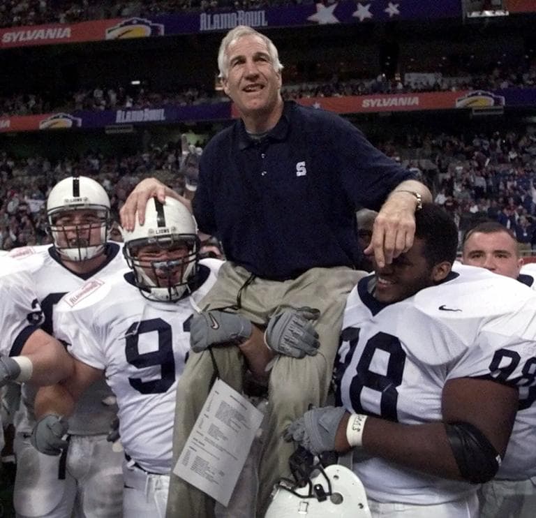 Jerry Sandusky is carried by players Rick Bolinsky (92) and Jason Wallace (88) after the 1999 Alamo Bowl in San Antonio. (AP)