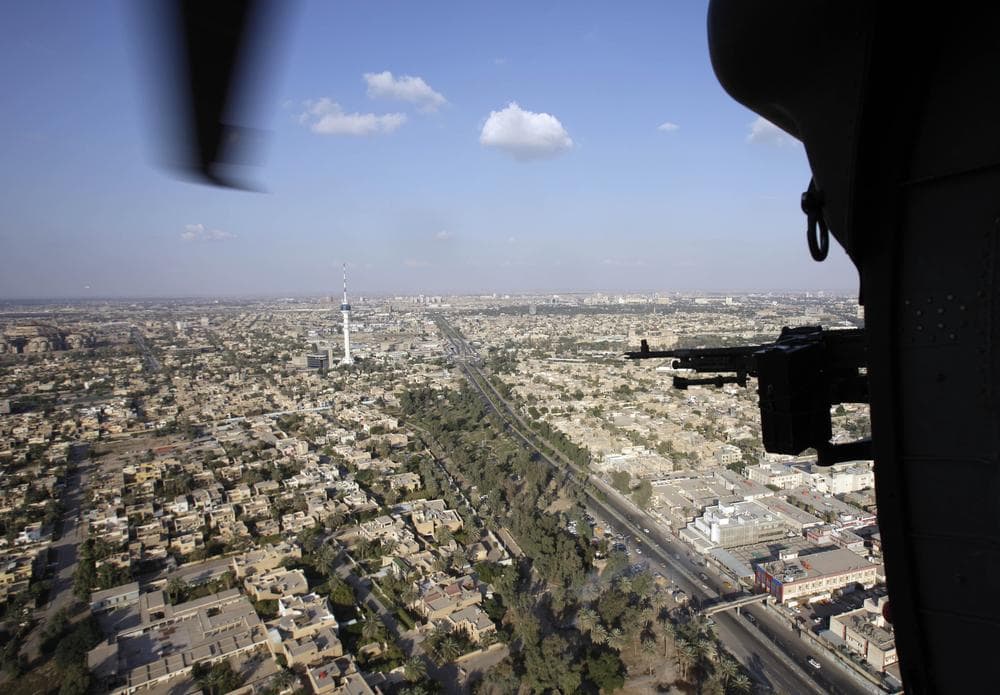 A U.S. Army Black Hawk helicopter flies over the city of Baghdad, Iraq. (AP)