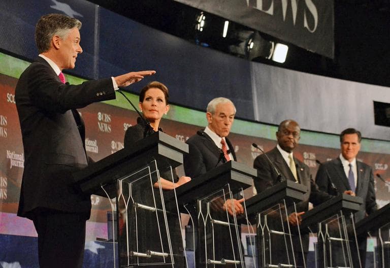 Republican presidential candidates from left, Jon Huntsman,  speaks as Michele Bachmann,  Ron Paul, Herman Cain, and Mitt Romney,  listen during the CBS News/National Journal foreign policy debate at the Benjamin Johnson Arena, Saturday, Nov. 12, 2011 in Spartanburg, S.C. (AP)