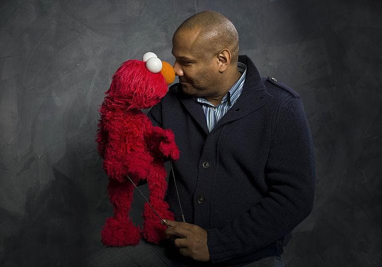 Elmo and puppeteer Kevin Clash of the film &quot;Being Elmo&quot; poses for a portrait in the Fender Music Lodge during the 2011 Sundance Film Festival. (AP Photo/Victoria Will)