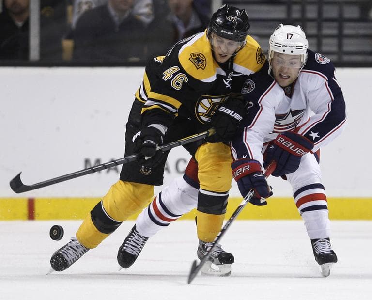 Boston Bruins center David Krejci, left, and Columbus Blue Jackets center Mark Letestu chase the puck during the second period of an NHL hockey game in Boston, Thursday. (AP)