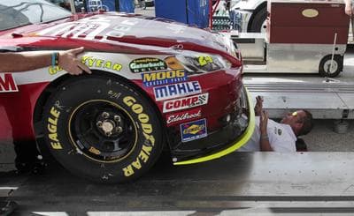 Driver Jeff Gordon's car gets a check-up before Sunday's NASCAR Ford 400 Sprint Cup series auto race. (AP)