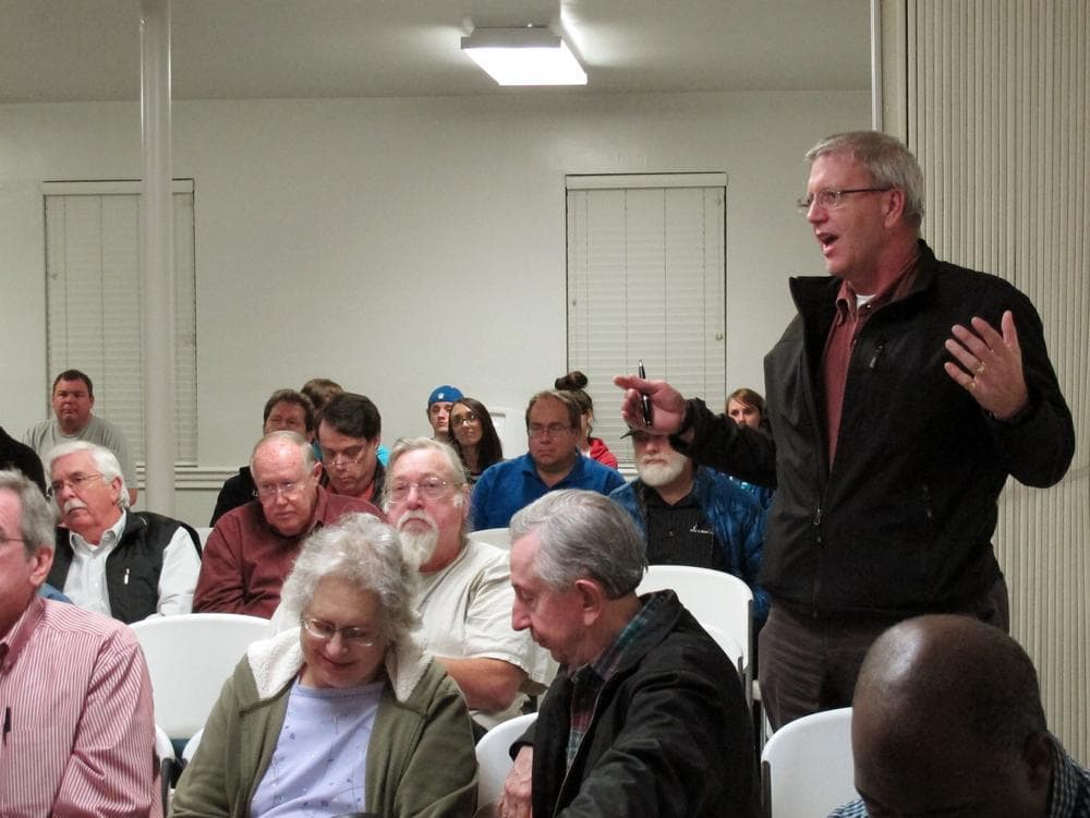 A member of the Mid-South Tea Party asks a question during a meeting where two Occupy Memphis members were speaking, Thursday in Bartlett, Tenn. (AP)