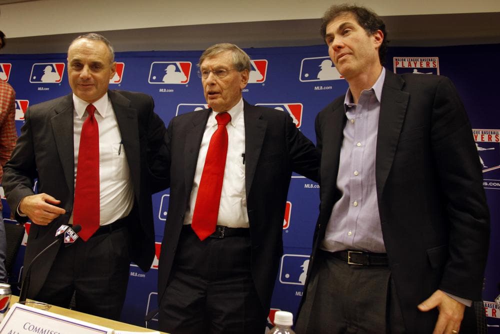 Major League Baseball commissioner bud Selig is flanked by VP of Labor Relations Rob Manfred and Players Association Executive Director Michael Weiner after announcing a new five-year collective bargaining agreement.  (AP)