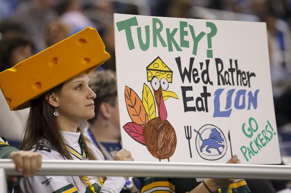 A Green Bay Packers fan pokes fun at the Detroit Lions during Thursday's traditional Thanksgiving day game in Detroit.  (AP)