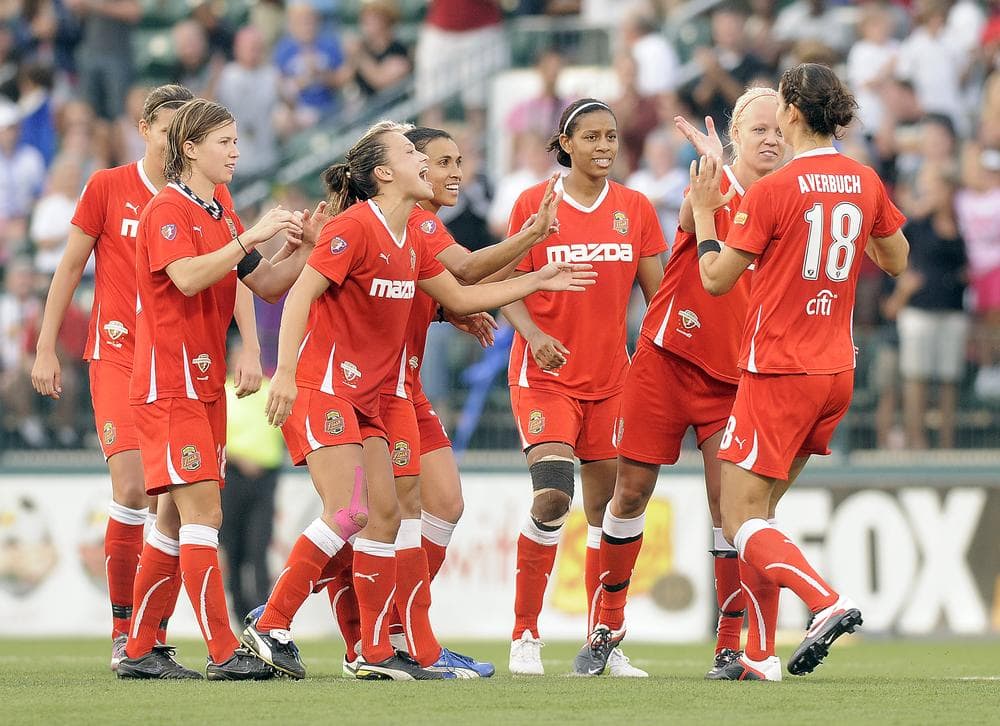 Members of the Western New York Flash congratulate teammate Yael Averbuch for her winning goal against the Philadelphia Independence in the WPS championship soccer game last August. (AP)
