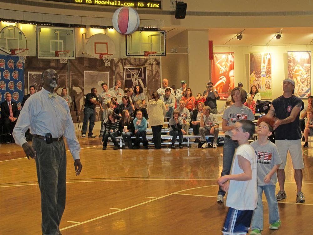 NBA great Tom &quot;Satch&quot; Sanders (l) rebounds with the Cummings family as Dave Cummings shoots at the Basketball Hall of Fame in Springfield, MA. (Doug Tribou/Only A Game)