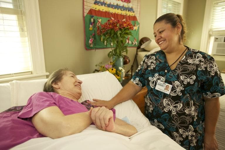 Hospice worker and Schwartz Center prizewinner Vilma Barrios with a patient
