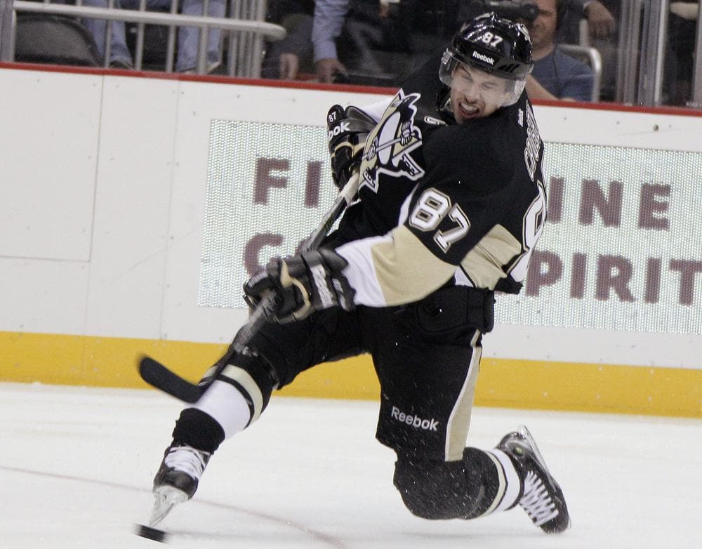 Pittsburgh Penguins star Sidney Crosby takes a slap shot on Nov. 21 in his first NHL game since January. (AP)