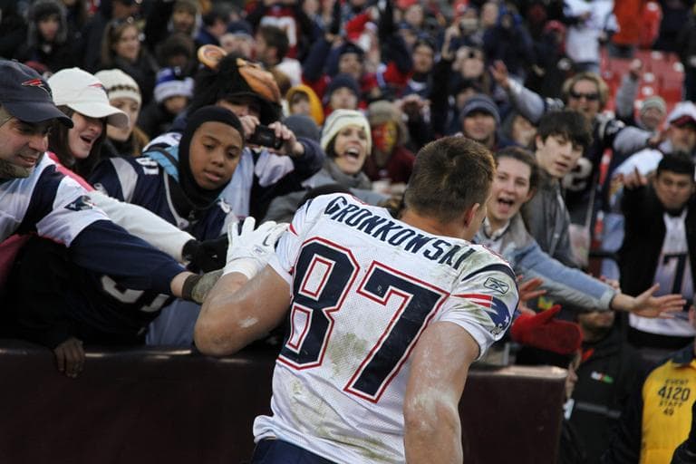 New England Patriots tight end Rob Gronkowski celebrates a 34-27 victory over the Washington Redskins with fans after the NFL football game on Sunday, Dec. 11 in Landover, Md.  (AP)