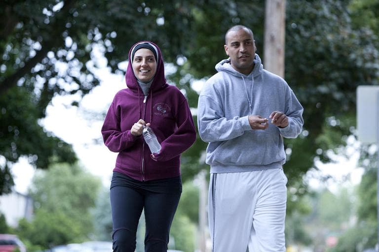 In this undated image provided by Discovery, Nawal Aoude, a pediatric respiratory therapist, left, and her husband Nader go for a walk in a scene from the TLC series, &quot;All-American Muslim.&quot; The series features five families from Dearborn, Mich., a city near Detroit with one of the highest concentrations of Arab descendants in the country. (AP)